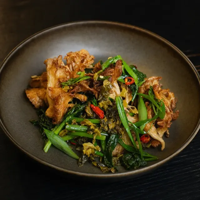 Illustrative crispy oyster mushrooms with mustard greens