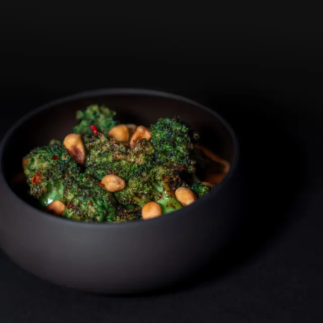 A dark bowl of broccoli from Mirin's supplied food gallery